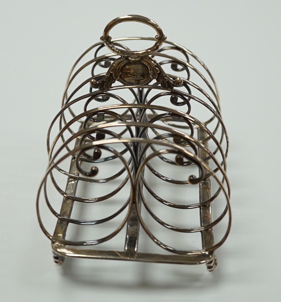 A William IV silver seven bar toastrack, with ring handle, on winged paw feet, Settle & Wilkinson, Sheffield, 1830, length 16.7cm, 10oz.